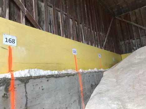An image of the Elk County salt storage shed interior that shows the painted salt level marks.
